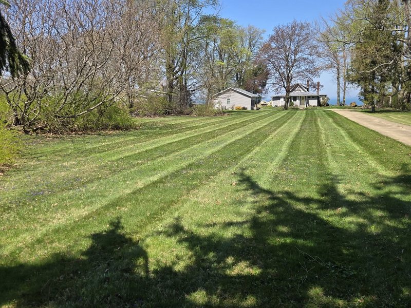 A striped, well-kept lawn maintained by Clean Fleet in Northeast Ohio
